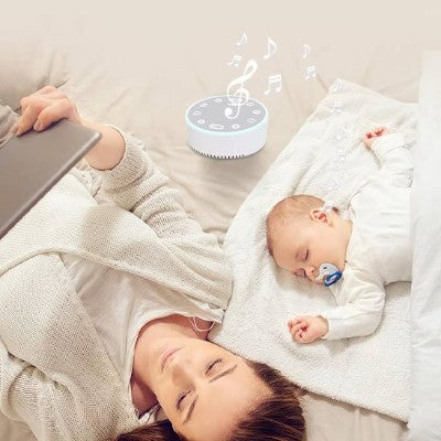 Veilleuse bruit blanc relaxant bébé allongé avec douceur.