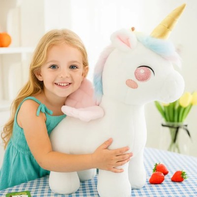 licorne peluche bébé - bébé câlinant blanche